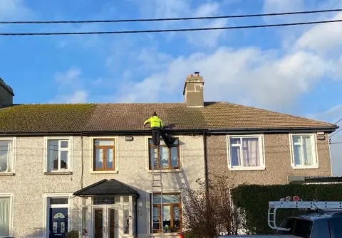 AG Direct roof cleaning work on a residential tiled roof